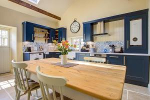 Køkken eller tekøkken på Coach Cottage Northumberland