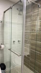 a shower with a glass door in a bathroom at el tambo de jhally 2 in Paipa +28 photos