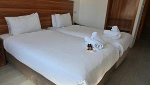 Postel nebo postele na pokoji v ubytování Hotel Centre Ville