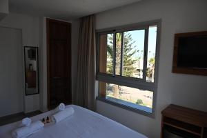 Postel nebo postele na pokoji v ubytování Hotel Centre Ville