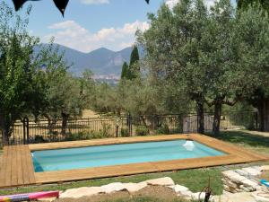 a swimming pool in a yard with trees at B&B Lattrazionedelgeco in Terni