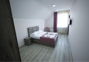 Letto o letti in una camera di ANGINE Resort Hotel