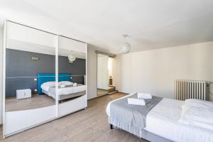 Ένα ή περισσότερα κρεβάτια σε δωμάτιο στο Au coeur du village Verzenay