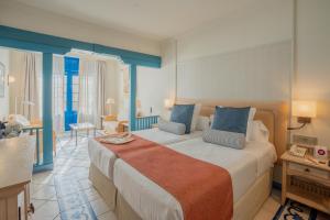 a bedroom with a large bed in a room at Hotel LIVVO Volcán Lanzarote in Playa Blanca