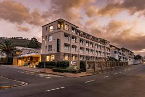 a tall building on the side of a street at The Cape Milner in Cape Town