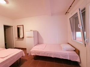 Letto o letti in una camera di Shkreli Apartments