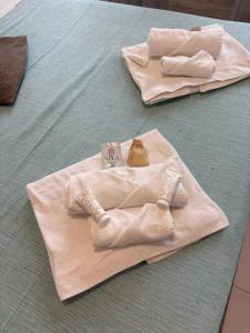 two towels sitting on top of a table at station 27 in Perugia +62 photos