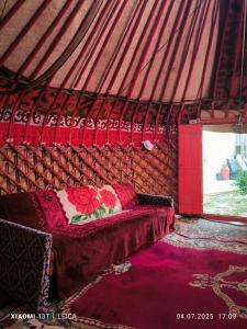 a bedroom with a bed in a yurt at ETHNO yurt in Karakol +12 photos