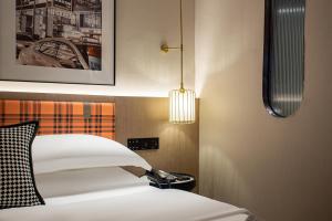 Postel nebo postele na pokoji v ubytování Huandong Manyi Hotel
