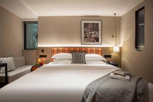 Postel nebo postele na pokoji v ubytování Huandong Manyi Hotel