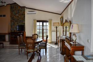 a living room with a dining room table and chairs at Anna's House in Alexandroupoli
