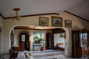 a living room with an archway in a house at Anna's House in Alexandroupoli