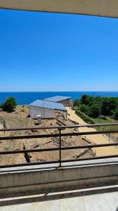 a group of train tracks with the ocean in the background at Апартаменты за гости Гавань in Byala