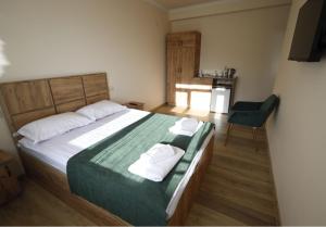 Letto o letti in una camera di ANGINE Resort Hotel