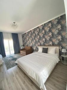 Postel nebo postele na pokoji v ubytování Guest House “Aura”