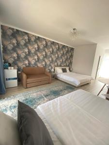 Postel nebo postele na pokoji v ubytování Guest House “Aura”