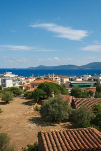 a view of a city with buildings and the ocean at Panorama in Methana