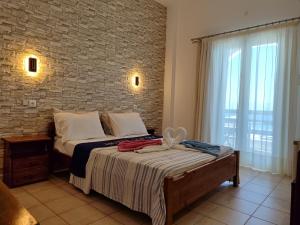 Postel nebo postele na pokoji v ubytování Corali Hotel