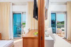 TV a/nebo společenská místnost v ubytování Hotel Rex
