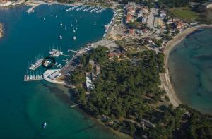 an aerial view of a harbor with boats in the water at Sailboat on the sea in Medulin