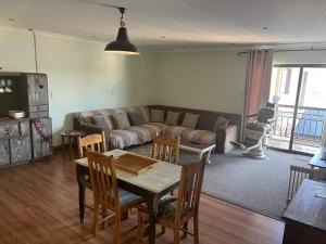 a living room with a couch and a table and chairs at Geust House 4288 in Bethlehem