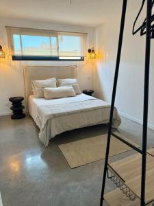 Postel nebo postele na pokoji v ubytování Appartement en rez-de-jardin