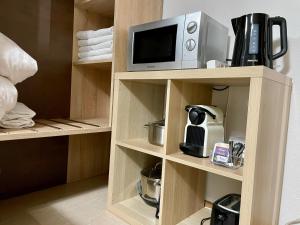 Příslušenství pro přípravu čaje a kávy v ubytování Hana Aparthotel