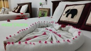Postel nebo postele na pokoji v ubytování Oleena Home Stay