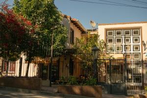a fence in front of a house at Hotel del Monumento in Salta