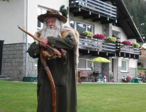 a statue of a man holding a rifle at Pension Arabela in Harrachov