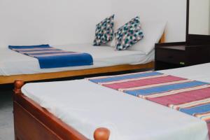 Postel nebo postele na pokoji v ubytování VD Rest Gampola