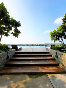 a set of stairs leading to the beach at Apt Vasanta Tokyo2 japanese 1BR in Jarakasta