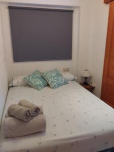 En eller flere senge i et værelse på Casa baja cerca del mar