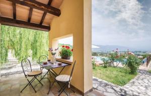 a table and chairs on a patio with a view at Casa Salvia, Ac, Wifi, Narni in Narni