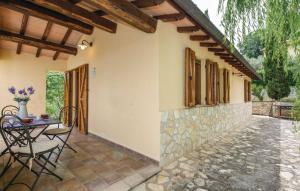 a patio of a house with a table and chairs at Casa Salvia, Ac, Wifi, Narni in Narni
