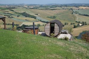 a round house on top of a hill at Casa In Collina in La Figurina