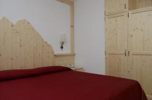 Postel nebo postele na pokoji v ubytování Hotel Corona