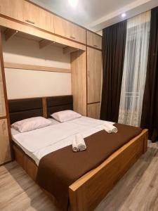 Ένα ή περισσότερα κρεβάτια σε δωμάτιο στο Tina`s Cozy Apartment