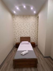 Ένα ή περισσότερα κρεβάτια σε δωμάτιο στο Tina`s Cozy Apartment