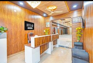 a lobby of a hair salon with wooden walls at Vrishti Residency & Hotels in Greater Noida +3 photos