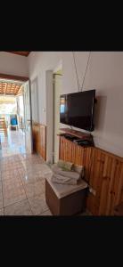 a living room with a flat screen tv on a wall at Silvana Room in Himare
