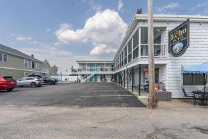 an empty parking lot in front of a building at Echo Motel in Old Orchard Beach +96 photos