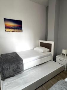 Postel nebo postele na pokoji v ubytování Vila Spiro