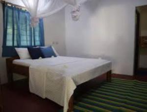 Postel nebo postele na pokoji v ubytování Didimiza Guest House