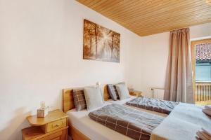 Postel nebo postele na pokoji v ubytování Die Bäckeralm