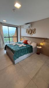 a bedroom with a bed and a large window at Eco resort Praia dos Carneiros in Praia dos Carneiros +54 photos