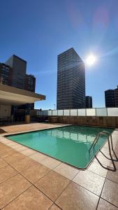 a swimming pool on the roof of a building at Modern Ocean-View Apartment in Durban