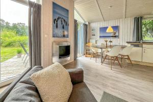 a living room with a couch and a table at Pulverhorn - Dorf 4 Ferienhaus 01 in Priwall