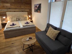 Rúm í herbergi á Appartement Steidl