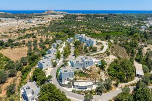 an aerial view of a house with the ocean in the background at Massari Hills Villa 9 in Malona Village